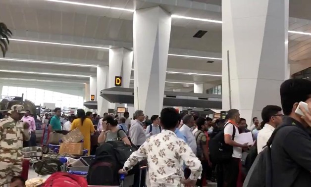 Crowds of people are seen at the Indira Gandhi International Airport in Delhi, India, April 27, 2019 in this picture obtained from social media. GARVITA GROVER/via REUTERS

