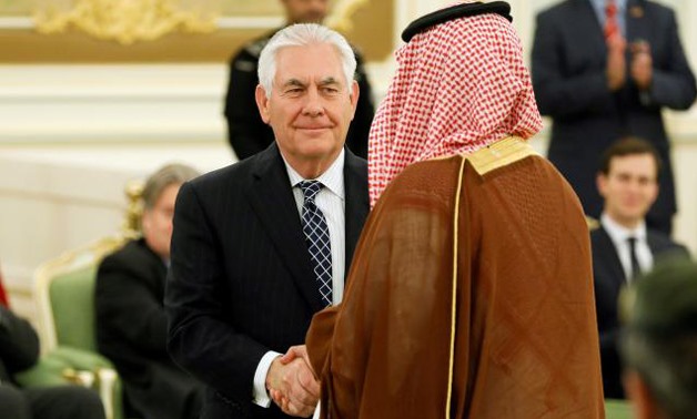 U.S. Secretary of State Rex Tillerson (C) shakes hand with a participant as he attends a signing ceremony between U.S. President Donald Trump and Saudi Arabia's King Salman bin Abdulaziz Al Saud at the Royal Court in Riyadh - REUTERS/File photo
