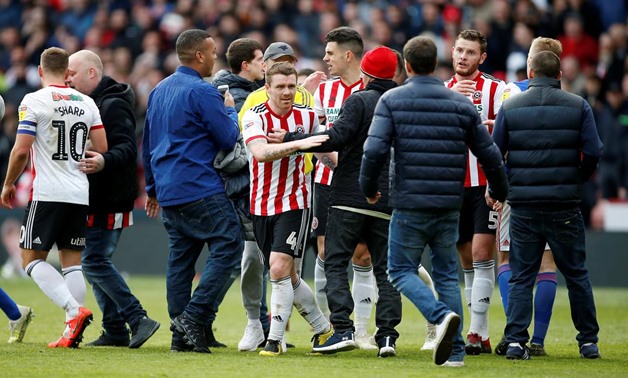Soccer Football - Championship - Sheffield United v Ipswich Town - Bramall Lane, Sheffield, Britain - April 27, 2019 Sheffield United's John Fleck and Jack O'Connell celebrate with fans on the pitch after the match Action Images/Craig Brough
