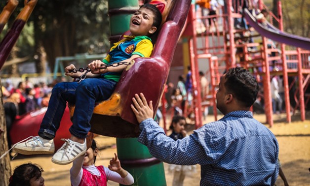 Children play during Sham El-Nessim celebration at Orman park on Monday - Egypt Today/Hazem Abdel-Samad