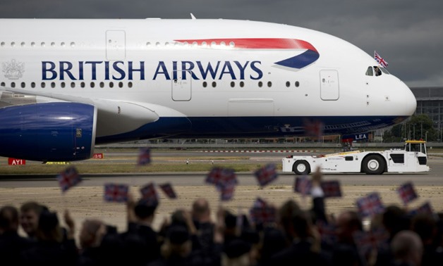 Profits at British Airways owner IAG slid to 27 million euros for the first quarter, a 74 percent slump – AFP/Justin Tallis
