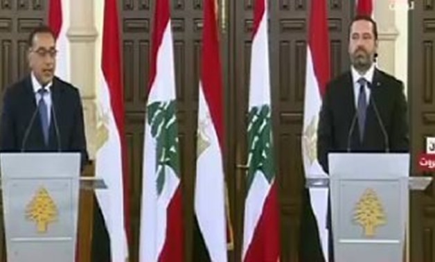 Prime Minister Mostafa Madbouly (L) with Lebanese counterpart Saadal-Hariri (R) - Press Photo