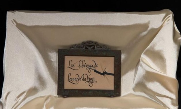 A lock of hair that is undergoing DNA testing is displayed in a box with the words written in French, 'hair of Leonardo da Vinci', in the Leonardo da Vinci museum in Vinci, in this undated photo released by the Leonardo da Vinci museum May 2, 2019. Leonar