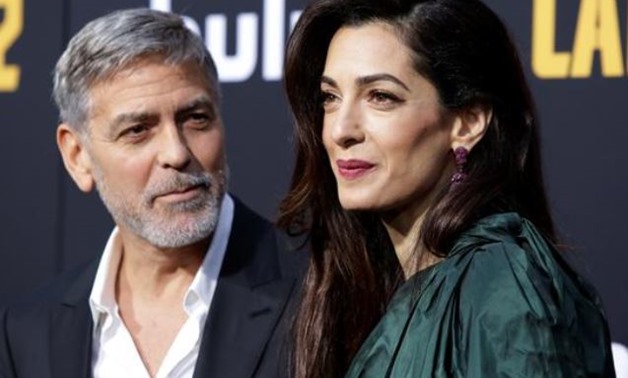 Clooney arrives with his wife Amal to the premier of "Catch 22" Reuters/Monica Almeida