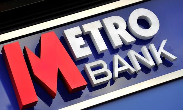 FILE PHOTO: A logo is seen on the outside of a branch of Metro Bank in central London July 28, 2010. REUTERS/Toby Melville/File Photo
