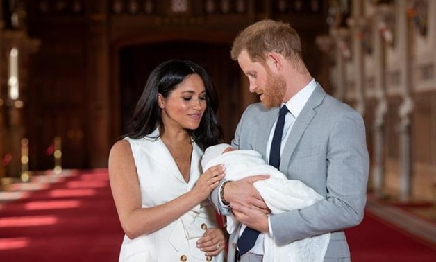 FILE PHOTO: FILE PHOTO: Britain's Prince Harry and Meghan, Duchess of Sussex are seen with their baby son, who was born on Monday morning, during a photocall in St George's Hall at Windsor Castle, in Berkshire, Britain May 8, 2019. Dominic Lipinski/Pool v
