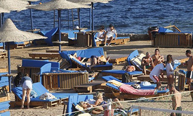 Tourists Enjoy The Sunny Weather At The Beach Of The Red Sea Resort Town Of Sharm El-Sheikh - AFP/Mohammed Abed