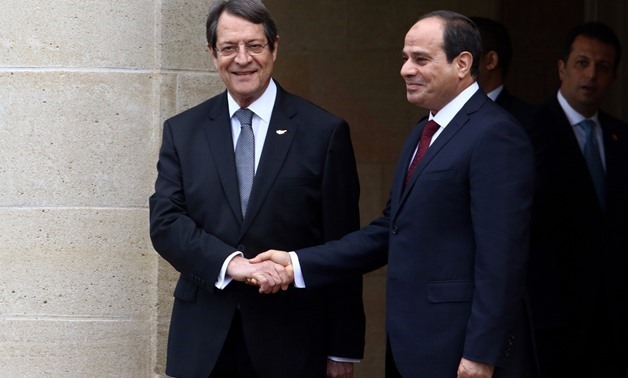 Cypriot President Nicos Anastasiades (L) and Egyptian President Abdel Fattah al-Sisi shake hands at the Presidential Palace in Nicosia, Cyprus November 20, 2017 - REUTERS/Yiannis Kourtoglou
