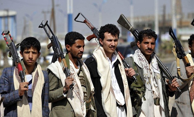  Armed members of Houthis gather at Sebin Square as they close the Sebin Road to traffic near presidential palace following the conflicts in Sana'a, Yemen. Photograph: Getty
