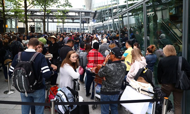 People queue with their luggage outside Heathrow Terminal 5 in London, Britain May 28, 2017. REUTERS/Neil Hall