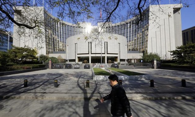 China's central bank will maintain basic stability of the yuan exchange rate within a reasonable and balanced range, according to comments posted on its website on Sunday.

