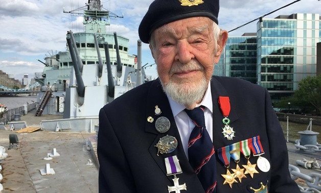 D-Day veteran Richard Llewellyn poses for a photograph on HMS Belfast, on the River Thames in London, Britain May 22, 2019. REUTERS/Alex Fraser
