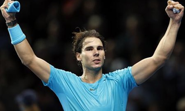 Rafael Nadal of Spain celebrates after winning his men's singles tennis match against Stanislas Wawrinka of Switzerland at the ATP World Tour Finals at the O2 Arena in London November 6, 2013. REUTERS/Suzanne Plunkett
