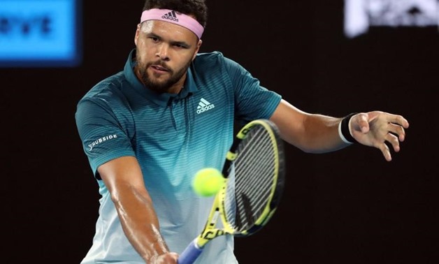 France's Jo-Wilfried Tsonga in action during the match against Serbia's Novak Djokovic. REUTERS/Lucy Nicholson
