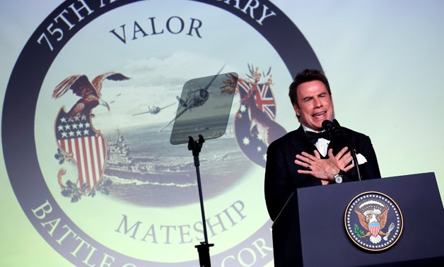 Actor John Travolta delivers remarks at an event commemorating the 75th anniversary of the Battle of the Coral Sea, aboard the USS - REUTERS/Jonathan Ernst