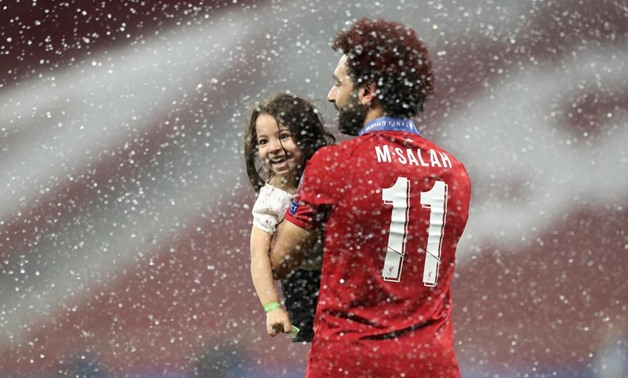 Mohamed Salah celebrates with his daughter after winning the Champions League Final, Reuters 

