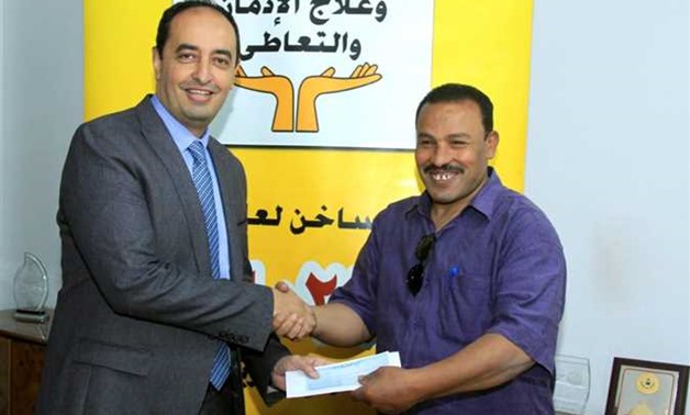 Amr Othman, assistant solidarity minister, has granted cheques of LE 160,000 for people who recovered from addiction to fund their projects – Press photo