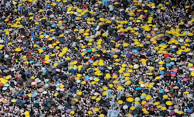 Demonstrators hold yellow umbrellas, the symbol of the Occupy Central movement, during a protest to demand authorities scrap a proposed extradition bill with China, in Hong Kong, China June 9, 2019. REUTERS/Thomas Peter
