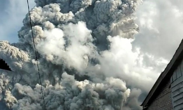 A volcanic ash cloud from Mount Sinabung hovers over Karo, North Sumatra, Indonesia June 9, 2019, in this still image taken from a social media video. Sinarisa Sitepu via REUTERS
