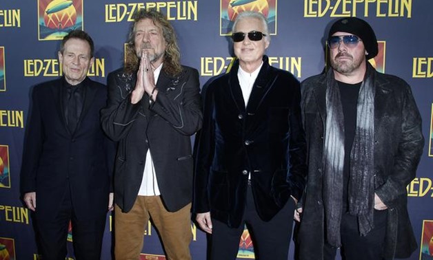 FILE PHOTO - Members of British rock band Led Zeppelin (L-R) bass player John Paul Jones, lead singer Robert Plant, guitarist Jimmy Page and drummer Jason Bonham, who replaces the band's original drummer his father John Bonham, arrive for the premiere of 