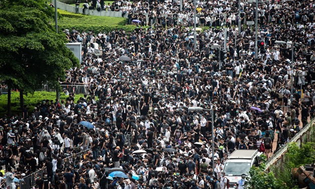 Protesters occupy the roads near the Legislative Council and government headquarters in Hong Kong on June 12, 2019 - AFP