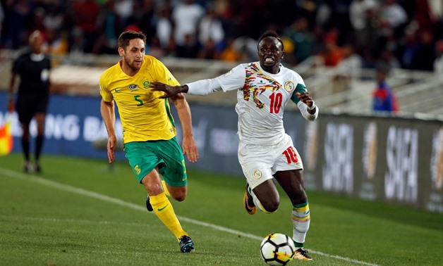 Soccer Football - 2018 World Cup Qualifiers - South Africa v Senegal - Peter Mokaba Stadium, Polokwane, South Africa - November 10, 2017 - Senegal's Sadio Mane in action with South Africa's Dean Furman. REUTERS/Siphiwe Sibeko

