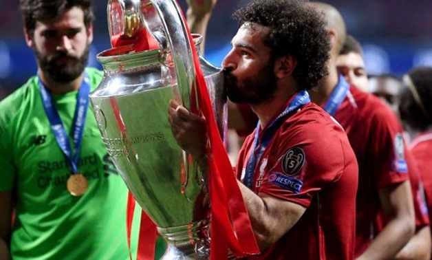 Mohamed Salah with the UEFA Champions League trophy - FILE