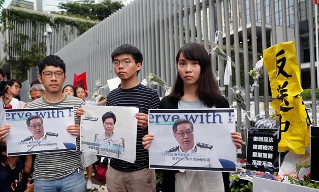 Pro-democracy activists Nathan Law, Joshua Wong and Agnes Chow attend a news conference regarding the proposed extradition bill, outside the Legislative Council building in Hong Kong, China June 18, 2019. REUTERS/Tyrone Siu
