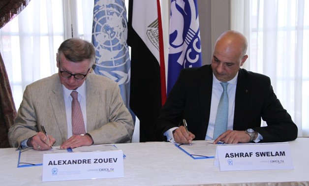 CCCPA's director Ashraf Swelam (R ) and Alexandre Zouev, assistant secretary-general for Rule of Law and Security Institutions (L) sign cooperation document- press photo