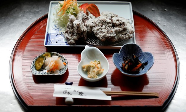 A set menu of deep-fried whale nuggets are prepared at the restaurant P-man in Minamiboso, east of Tokyo, Japan June 14, 2019. REUTERS/Issei Kato
