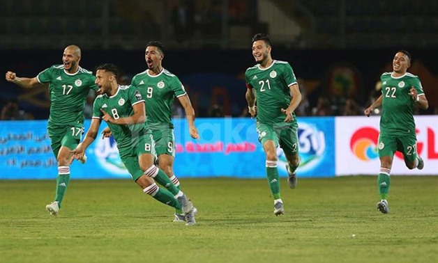 Soccer Football - Africa Cup of Nations 2019 - Group C - Senegal v Algeria - 30 June Stadium, Cairo, Egypt - June 27, 2019 Algeria's Youcef Belaili celebrates scoring their first goal with Baghdad Bounedjah and team mates REUTERS/Amr Abdallah Dalsh
