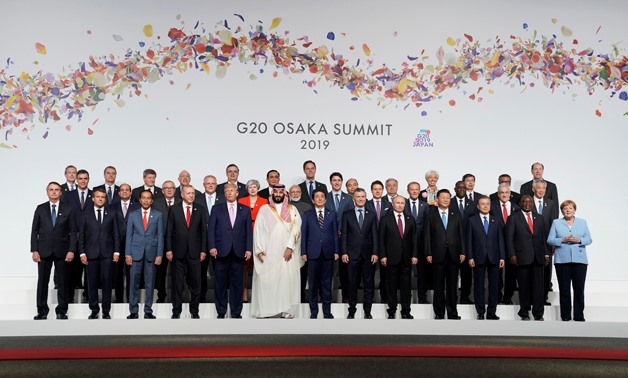 Leaders and delegates attend a family photo session at the G20 leaders summit in Osaka, Japan, June 28, 2019.  REUTERS/Kevin Lamarque