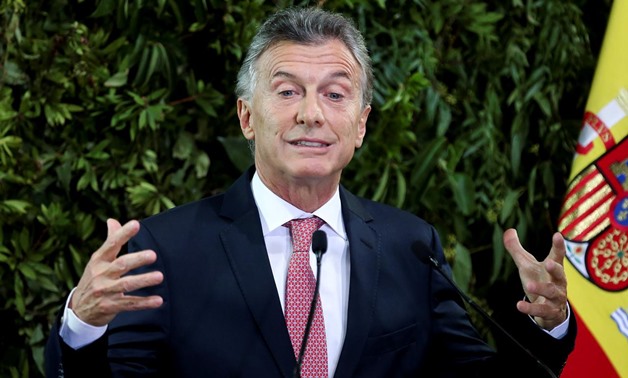 FILE PHOTO: Argentina's President Mauricio Macri gestures as he gives a speech during a state dinner at the Centro Cultural Kirchner, in Buenos Aires
