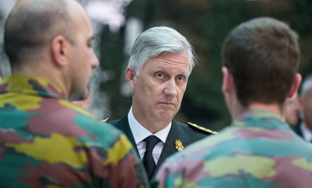 King Philippe of Belgium speaks with Belgian soldiers during a visit at a military camp - REUTERS/Stephanie Lecocq
