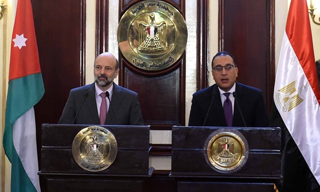 FILE - Jordanian Prime Minister Omar Al-Razzaz (L) holds a press conference with Egyptian Prime Minister Mostafa Madbouli (R) in Cairo - Press photo