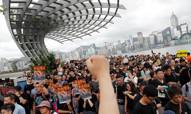 Anti-extradition bill protesters march to West Kowloon Express Rail Link Station at Hong Kong's tourism district Tsim Sha Tsui, China July 7, 2019. REUTERS/Tyrone Siu
