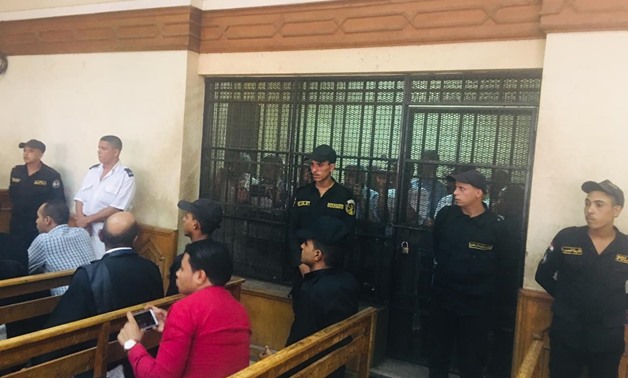 The 14 defendants charged with negligence in the lawsuit dubbed “Ramses Station Blaze” appear before Cairo Criminal Court’s judiciary panel in the first trial session. July 9, 2019. Egypt Today