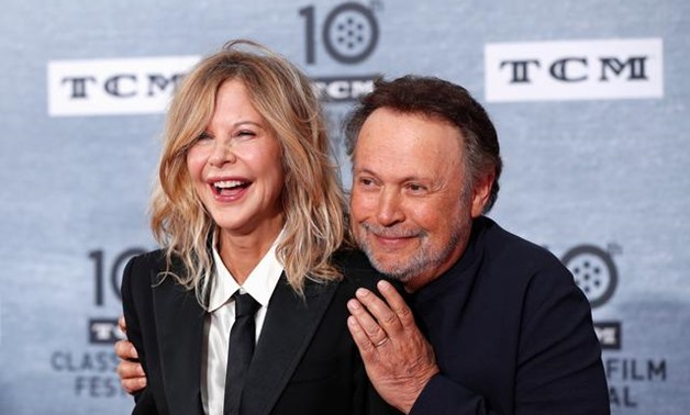 Cast members Billy Crystal and Meg Ryan pose as they arrive for the 30th anniversary screening of comedy movie "When Harry Met Sally" in Hollywood, California, U.S. April 11, 2019. REUTERS/Mario Anzuoni.