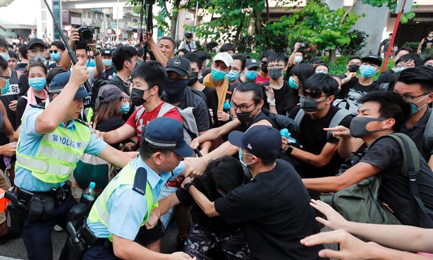 Police try to disperse pro-democracy activists after a march at Sheung Shui, a city border town in Hong Kong, China July 13, 2019. REUTERS/Tyrone Siu
