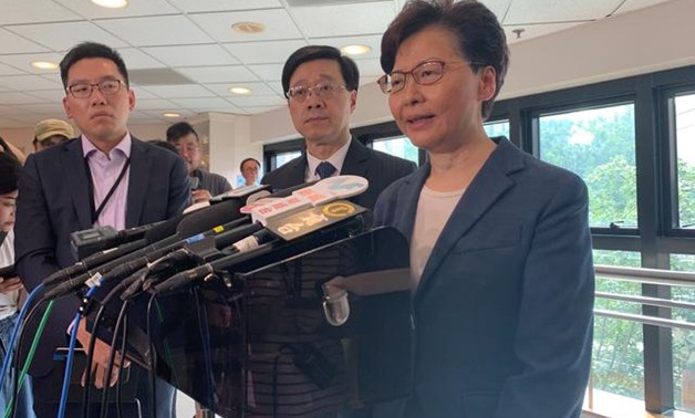 Hong Kong Chief Executive Carrie Lam (R) and Secretary for Security John Lee Ka-chiu speak to media over an extradition bill protest in Hong Kong, China July 15, 2019. REUTERS/Joyce Zhou
