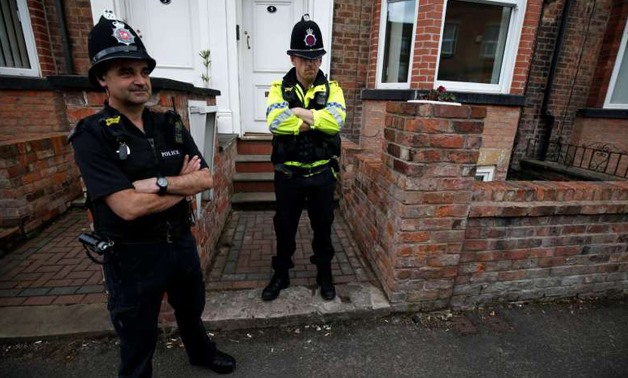 Police stand outside a property after the bomb squad were called to a search in Wigan, Britain, May 30, 2017 - REUTERS

