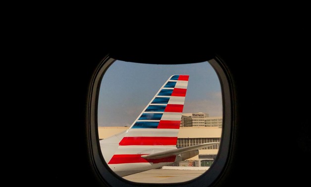 FILE PHOTO: An American Airlines airplane sits on the tarmac at LAX in Los Angeles, California, U.S., March 4, 2019. Picture taken March 4, 2019. REUTERS/Lucy Nicholson
