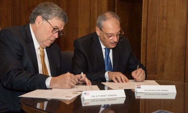 Egypt’s Public Prosecutor Nabil Sadek and United States Attorney General in the Donald Trump administration William Barr sign on Thursday a memorandum of understanding for judicial cooperation in Washington – Courtesy of the US Department of Justice
