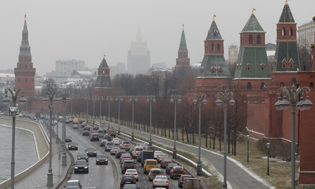 Vehicles drive past the wall and towers of the Kremlin in central Moscow, Russia November 29, 2017. REUTERS/Maxim Shemetov