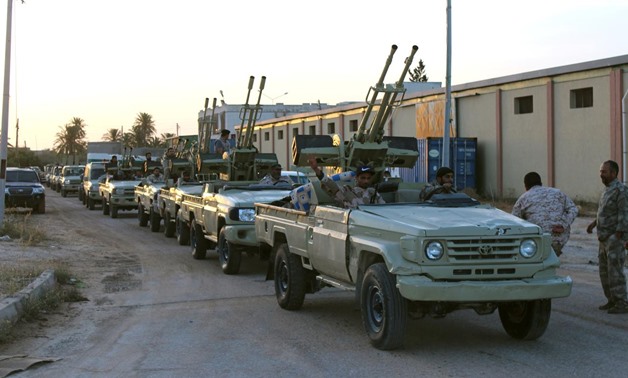 Military vehicles of members of the Libyan internationally recognised government forces head out from Misrata to the front line in Tripoli, Misrata, Libya May 10, 2019. REUTERS/Ayman Al-Sahili