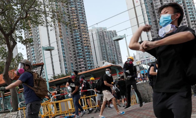Protesters hurl objects at the police during a demonstration in support of the city-wide strike and to call for democratic reforms at Tin Shui Wai in Hong Kong, China, August 5, 2019. REUTERS/Tyrone Siu
