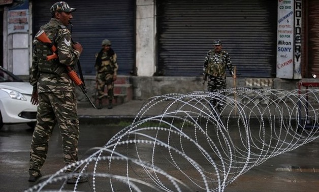 Indian security forces personnel patrol a deserted street during restrictions after the government scrapped special status for Kashmir, in Srinagar August 7, 2019. REUTERS/Danish Ismail
