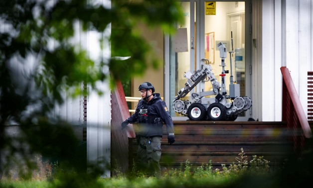 A man is seen near the site after a shooting in al-Noor Islamic center mosque, near Oslo, Norway August 10, 2019. NTB Scanpix/Terje Pedersen via REUTERS ATTENTION EDITORS - THIS IMAGE WAS PROVIDED BY A THIRD PARTY. NORWAY OUT. NO COMMERCIAL OR EDITORIAL S