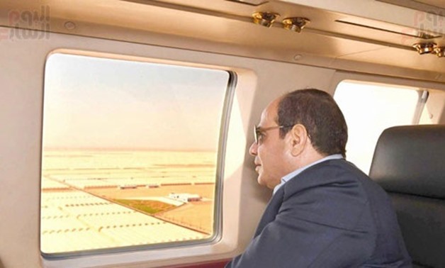 President Abdel Fatah el Sisi on Sunday made an inspection tour by a plane in the greenhouses' project at Mohamed Naguib military base - Press Photo