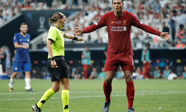 Referee Stephanie Frappart as Liverpool's Virgil van Dijk reacts after she awarded a penalty to Chelsea, Reuters